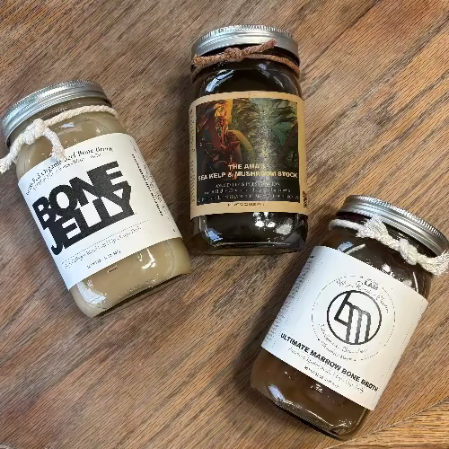 three jars of organic bone broth, bone jelly and mushroom stock